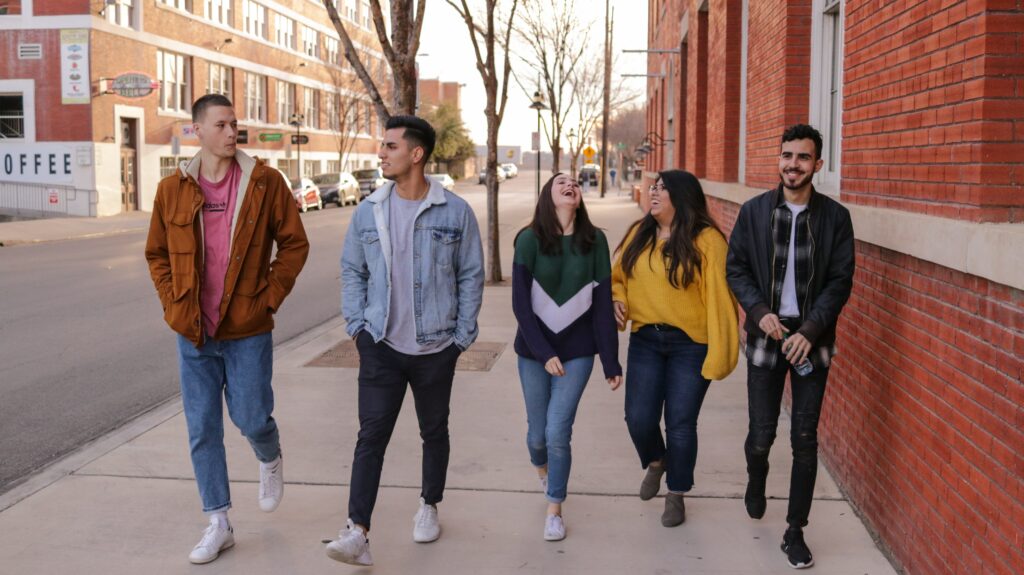 College students walking and smiling